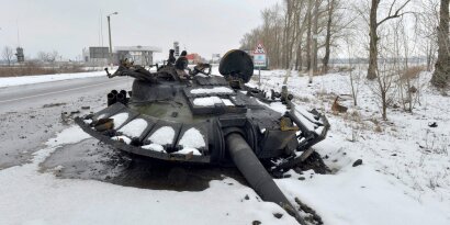 destroyed Russian tank is seen on the roadside on the outskirts of Kharkiv on February 26, 2022