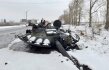 destroyed Russian tank is seen on the roadside on the outskirts of Kharkiv on February 26, 2022